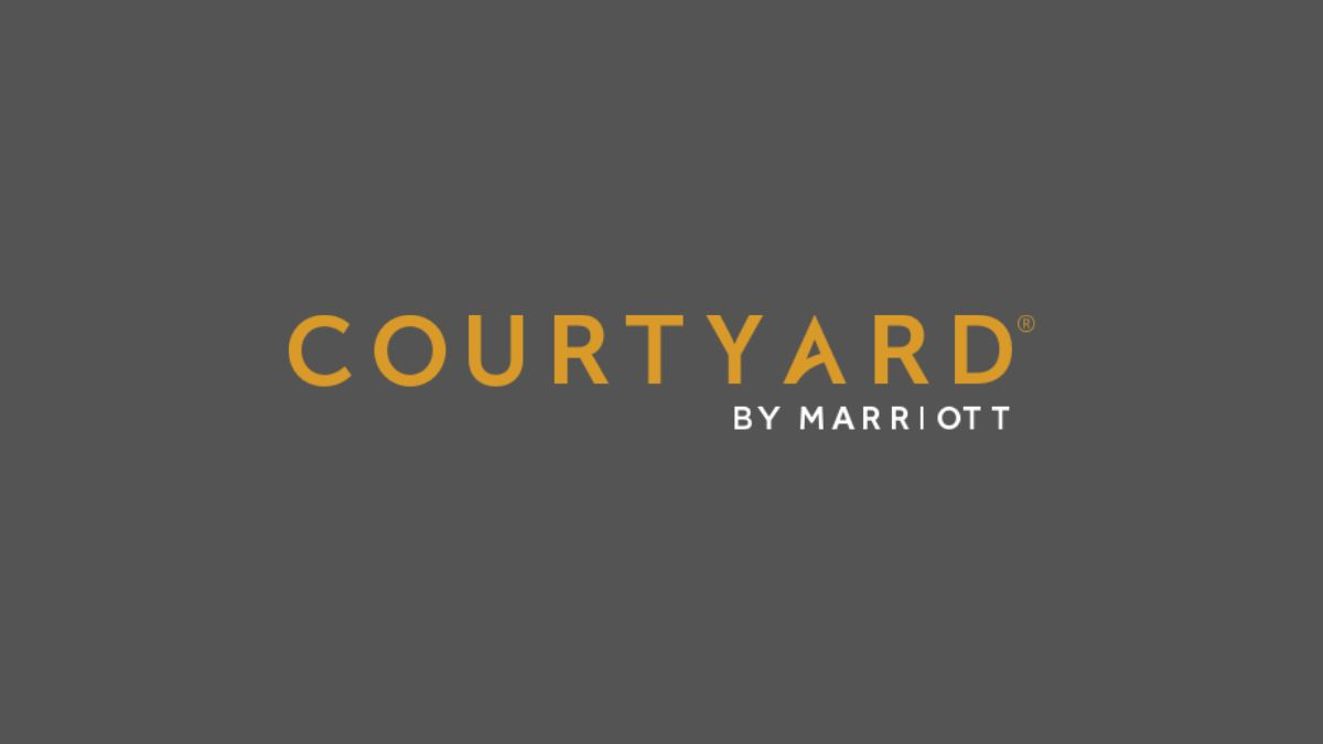 Courtyard by Marriott Hotels logo in orange and white on a dark gray background