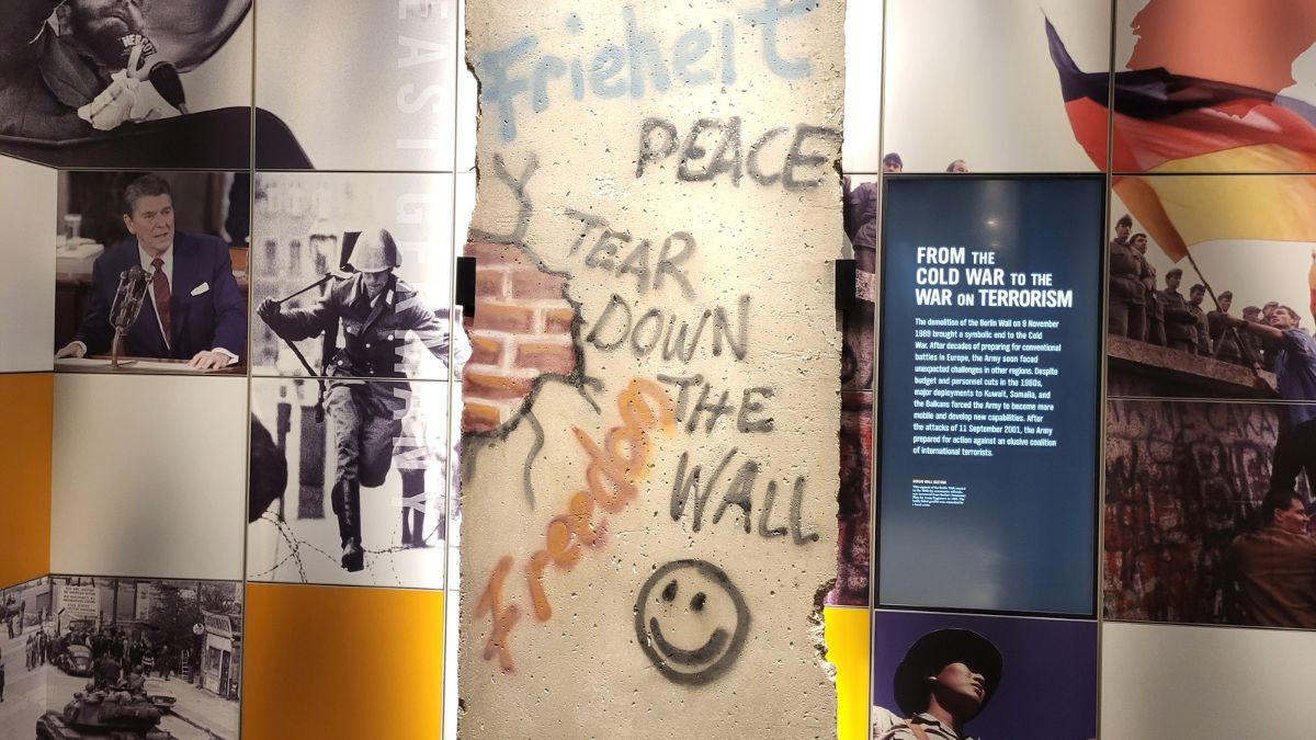 Section of the Berlin Wall on display inside the National Museum of the United States Army in Fort Belvoir, Virginia, with graffiti reading ‘Tear Down the Wall.