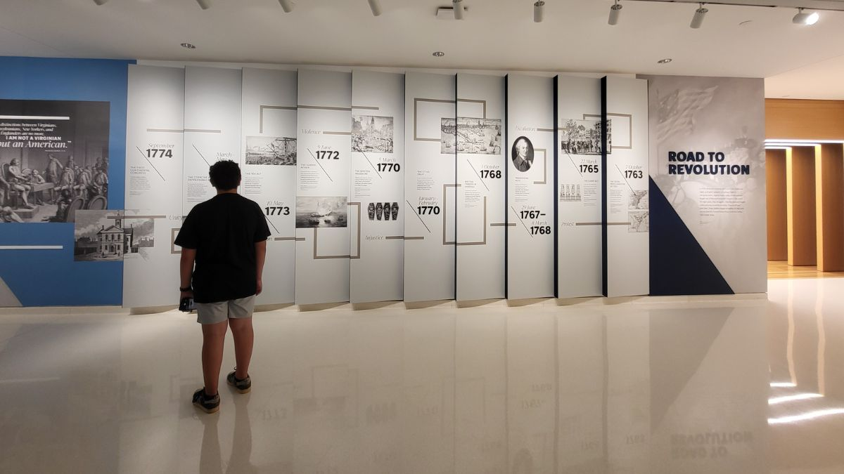 Mateo from This Teen Travelz exploring the ‘Road to Revolution’ exhibit at the National Museum of the United States Army in Fort Belvoir, Virginia.
