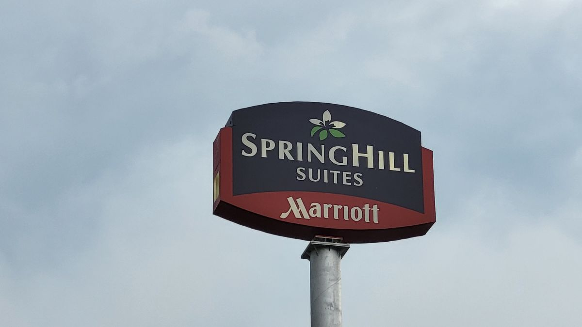 SpringHill Suites by Marriott hotel sign in Lumberton, North Carolina, captured on a summer evening.