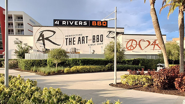 Exterior of 4 Rivers Smokehouse at ONE Daytona, a popular teen-friendly BBQ spot near Daytona International Speedway