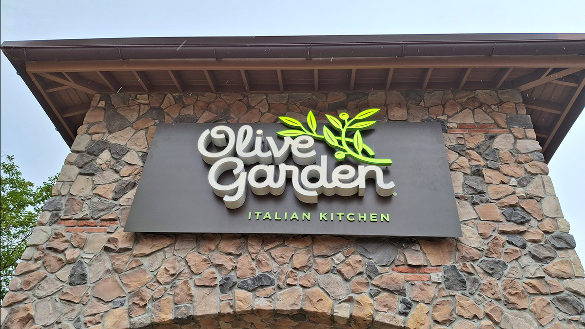Olive Garden Italian Kitchen sign at ONE Daytona, a familiar teen-friendly restaurant option for pasta and comfort food